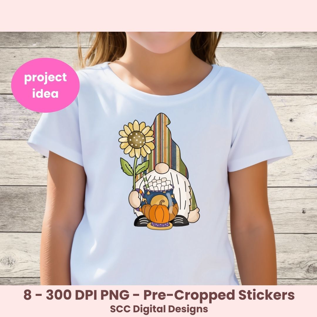 A child wearing a white short-sleeve T-shirt with a colorful fall gnome graphic on the chest, standing against a light wood plank background. A pink circular badge says 'project idea' and the bottom text reads '8 - 300 DPI PNG - Pre-Cropped Stickers' and 'SCC Digital Designs'.