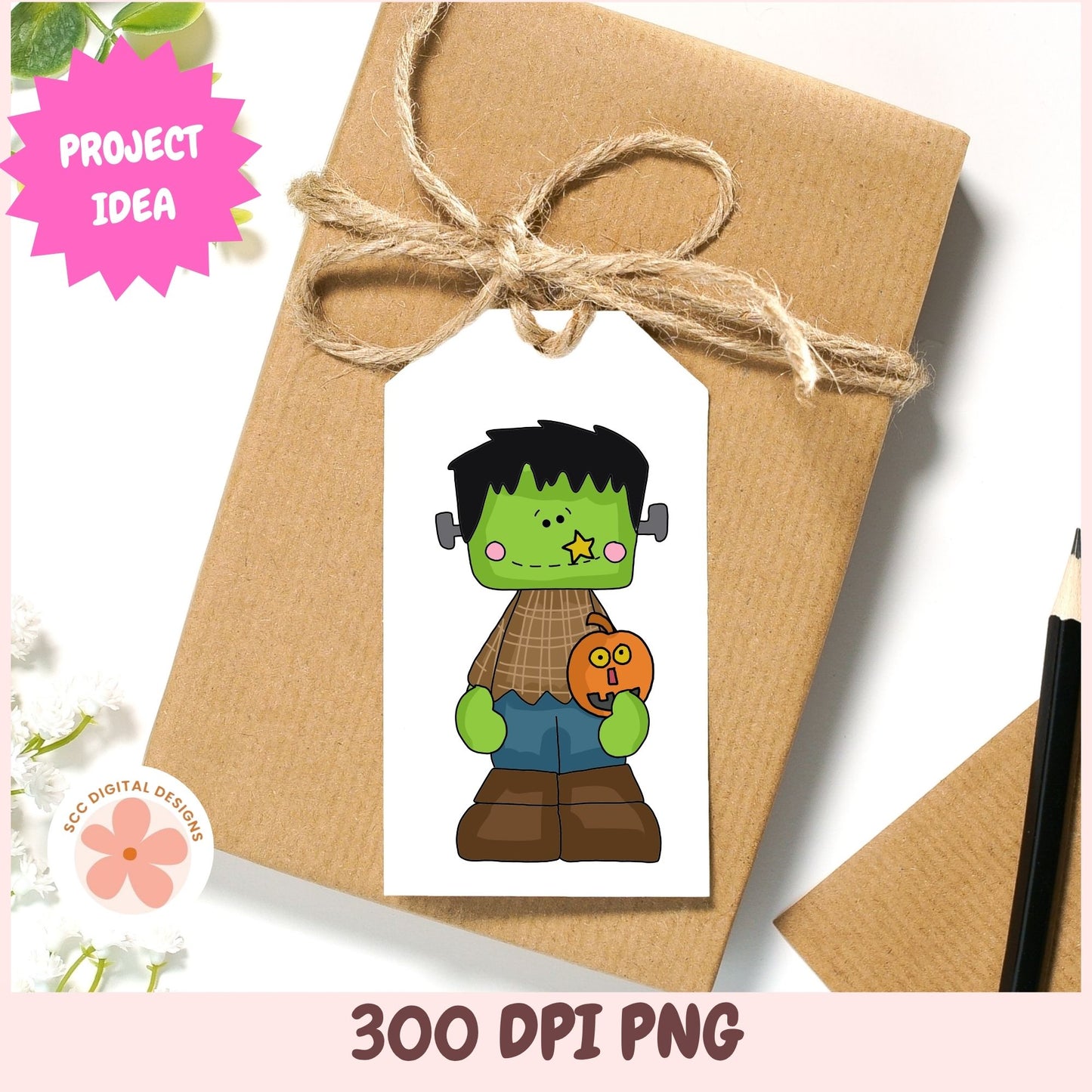 A Halloween-themed printable tag design shown on a kraft paper gift box tied with twine. The tag features a cartoon Frankenstein character with green skin, black hair, a brown plaid shirt, blue pants, and a small orange pumpkin.