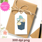 Gift box with a decorative tag featuring a cartoon gnome, tied with twine on a white background.