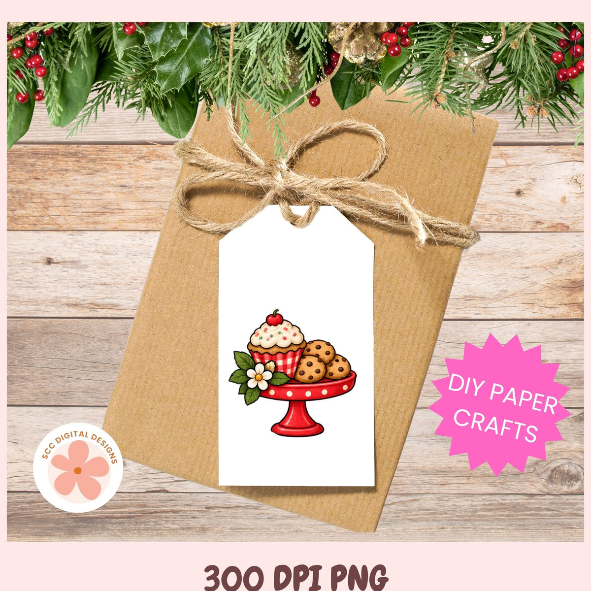 A kraft paper envelope tied with twine and a white gift tag printed with a cupcake and cookie illustration, shown on a wood plank background with holiday greenery and a pink 'DIY PAPER CRAFTS' badge. Text at the bottom reads '300 DPI PNG' and a circular logo says 'SVG DIGITAL DESIGNS'.