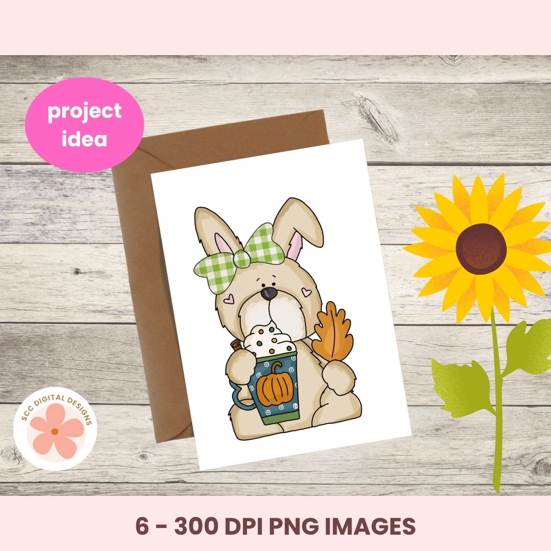 A digital preview of an Easter-themed greeting card design featuring a cartoon bunny holding a mug and sandwich, displayed on a wooden background with a brown envelope, a pink 'project idea' badge, and a sunflower graphic.