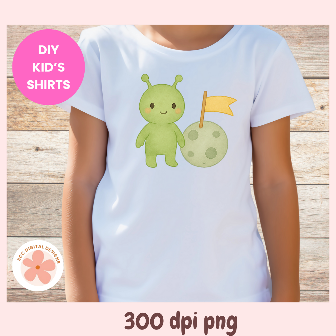 White t-shirt with a green alien design on a wooden surface, labeled 'DIY Kids' Shirts'.
