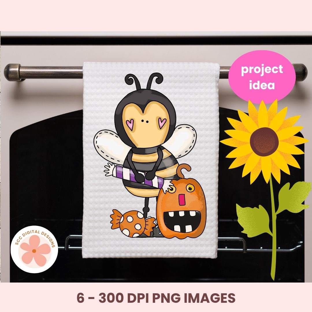 A white kitchen towel hanging on an oven rack, printed with a cute cartoon bee wearing a purple-and-white striped shirt and holding a pumpkin, with candy accents. The image includes a pink 'project idea' badge, a sunflower graphic, a circular '6 - 300 DPI PNG IMAGES' label, and a pink background border.