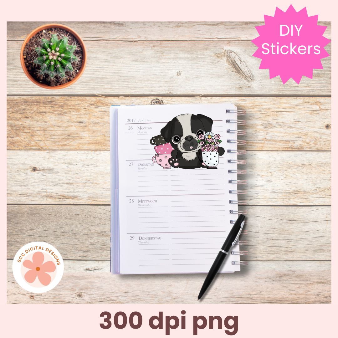 Notebook with a dog illustration on a wooden surface with a cactus plant and pen.