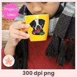 Person holding a yellow mug with a dog illustration, wearing a checkered scarf.