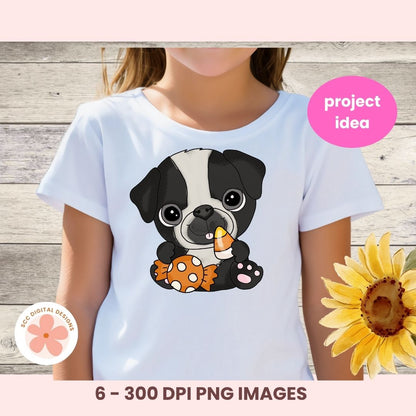 A child wearing a white short-sleeve T-shirt with a cartoon black-and-white puppy graphic holding an orange pumpkin and a yellow candy corn. The photo is styled with a pink 'project idea' badge, a flower watermark, and text reading '6 - 300 DPI PNG IMAGES' over a wood plank background.