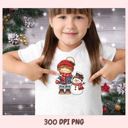 A young girl with brown hair in pigtails points at a graphic print on her white t-shirt. The graphic features a cute cartoon illustration of a girl in a red hat and scarf next to a snowman.