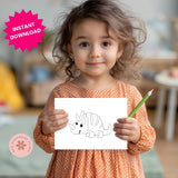 Child holding a drawing of a dinosaur with a green pencil, in a home setting.