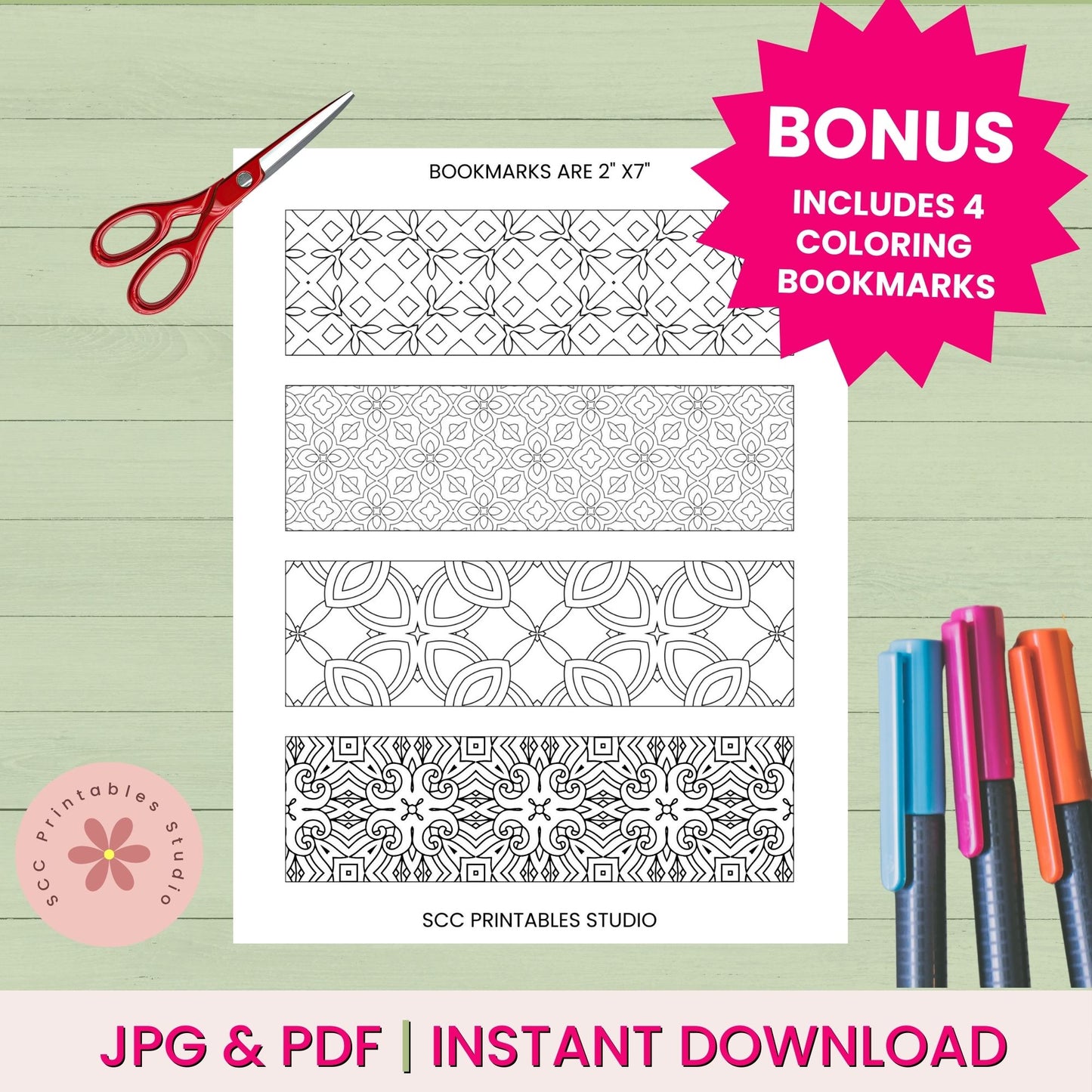 Coloring bookmarks with geometric patterns, scissors, and markers on a wooden surface.