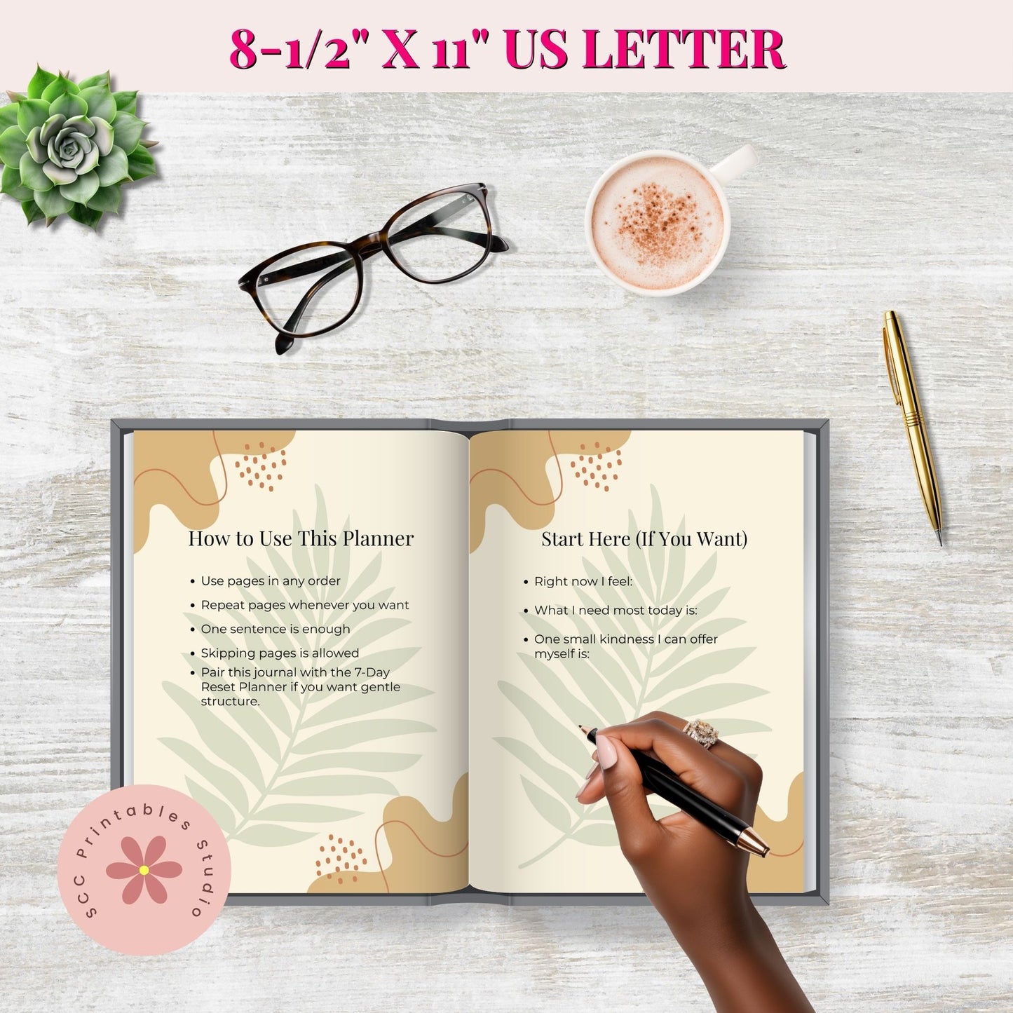 Open planner with instructions on a wooden surface with a cup of coffee, glasses, and pen.