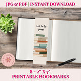 Printable bookmarks with book design on a wooden surface with a pen and succulent.