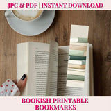 Open book with a hand holding it, next to a cup of coffee on a wooden surface, with text about bookish printable bookmarks.