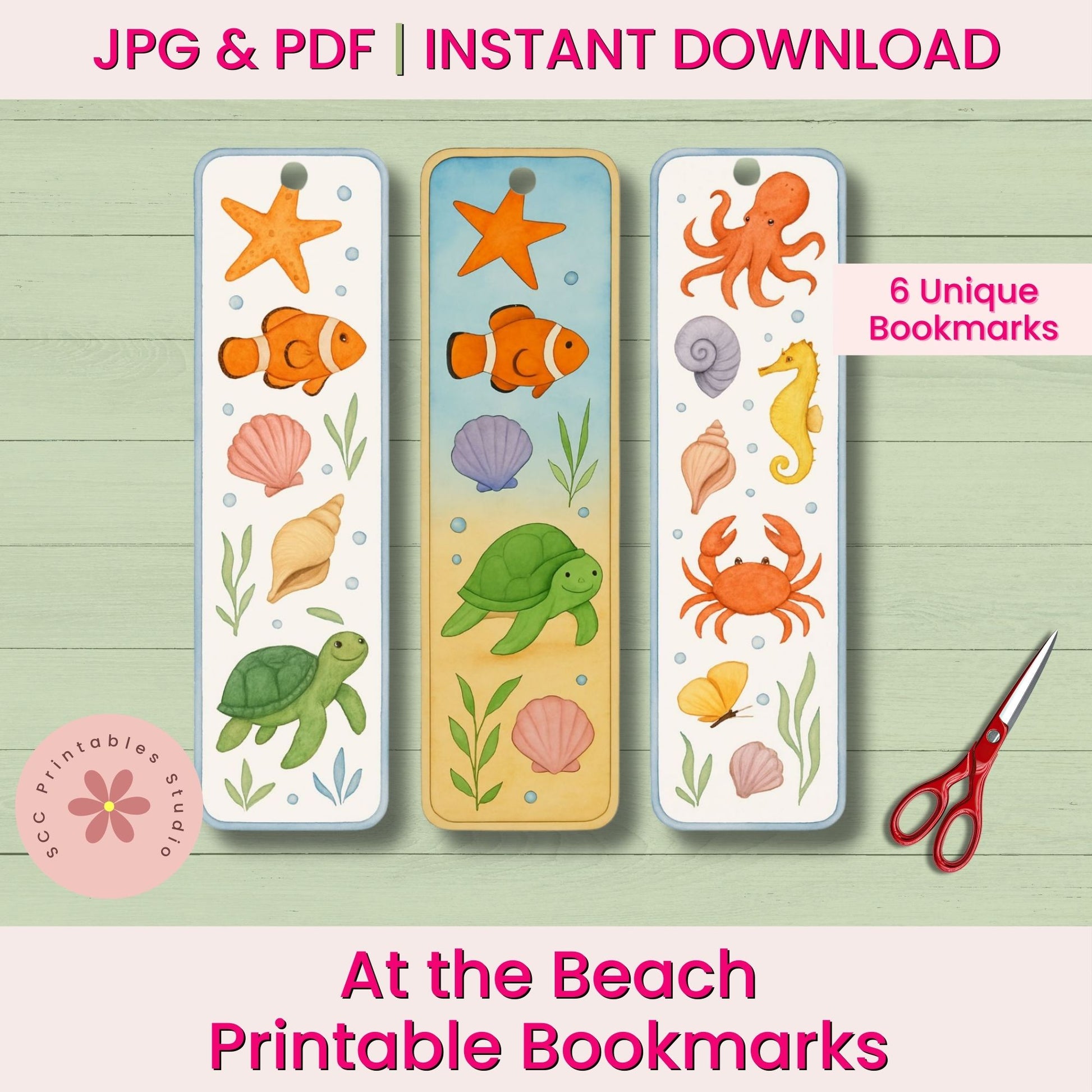 Set of three printable bookmarks with ocean-themed illustrations on a wooden surface with scissors.