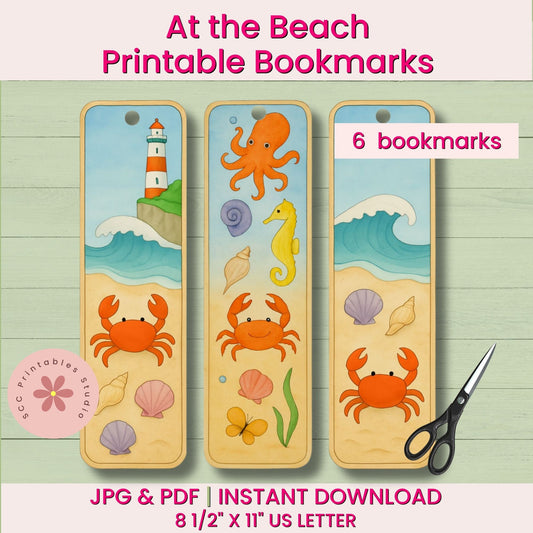 Set of three beach-themed bookmarks with crabs, octopus, and seahorse on a wooden surface with scissors.