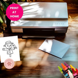 Printer on a wooden surface with a printed sheet and markers, featuring 'Print at Home' text.