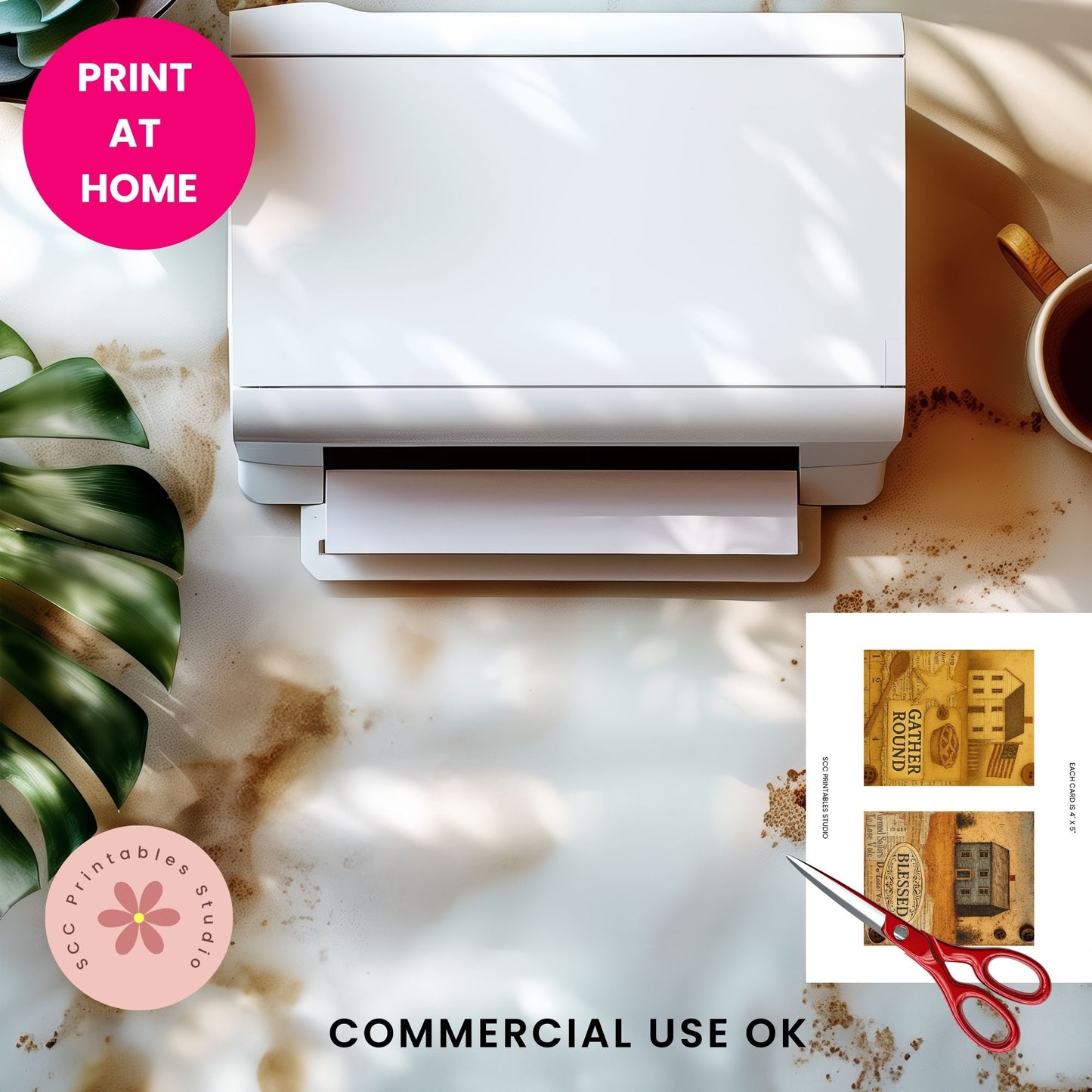 White printer on a marble surface with a cup of coffee, plant, and printed product with scissors.