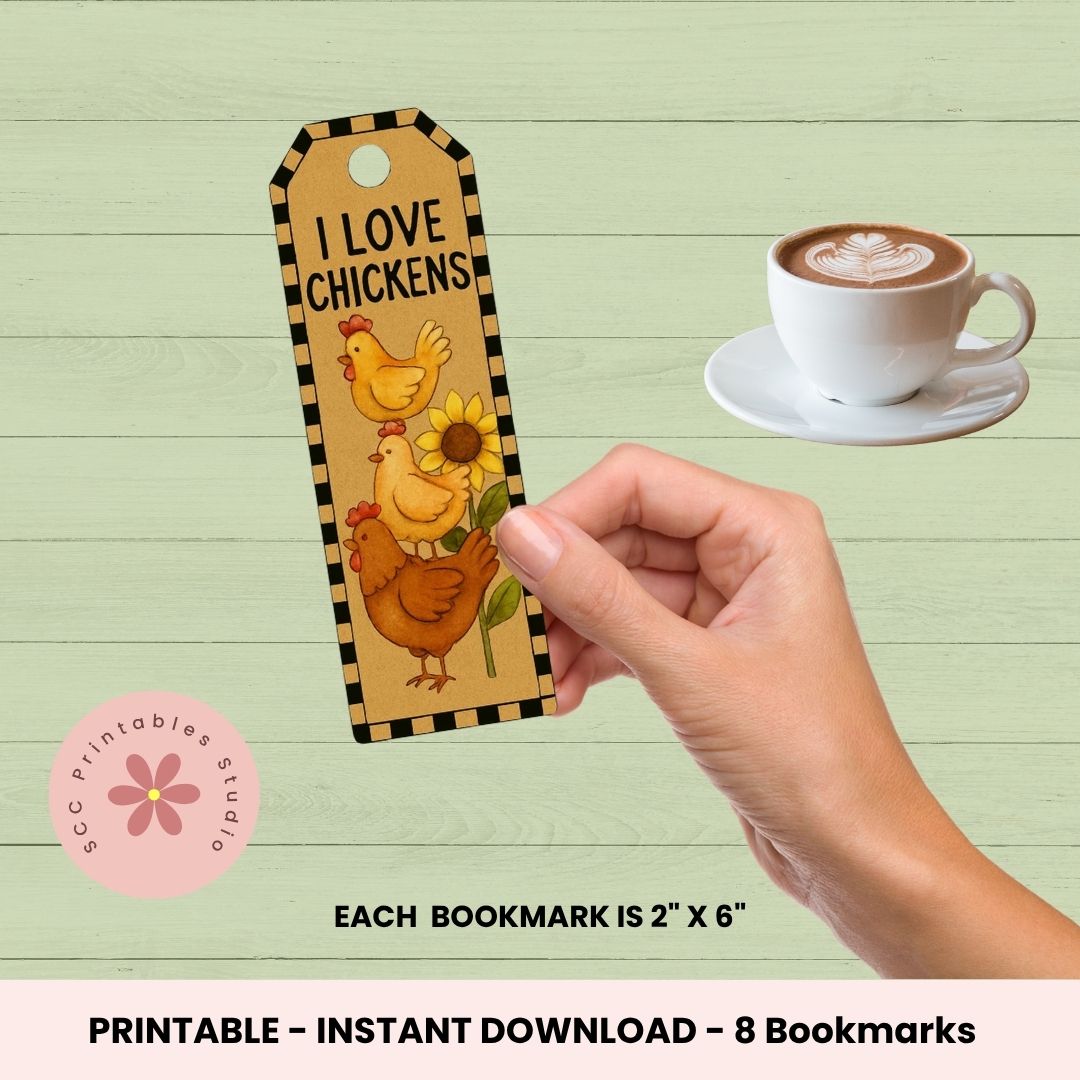 Hand holding a 'I Love Chickens' bookmark with a cup of coffee on a wooden surface.