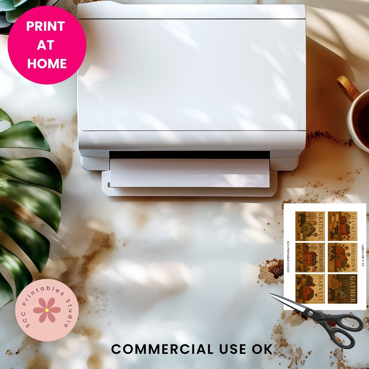 White printer on a marble surface with a cup, plant, and printed sheet of stamps.