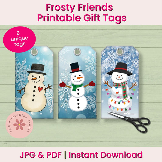 Three printable snowman gift tags on a light wood background with text reading 'Frosty Friends Printable Gift Tags,' '6 unique tags,' and 'JPG & PDF | Instant Download.' A pink circular badge says '6 unique tags,' and a scissors icon appears at the lower right.