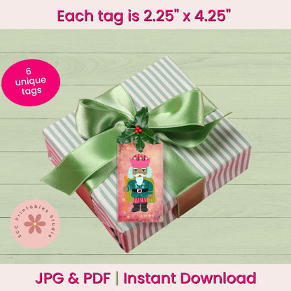 A gift box wrapped in pale green and white striped paper, tied with a satin green ribbon and decorated with a Christmas nutcracker tag. The image includes text overlays stating 'Each tag is 2.