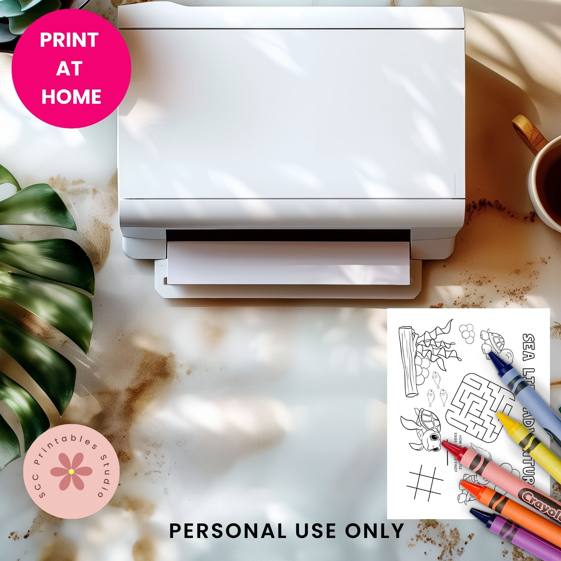 White printer on a marble surface with coloring pages and crayons, featuring 'Print at Home' text.