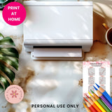 White printer on a desk with colored pencils and a plant, featuring 'Print at Home' text.